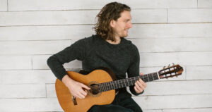 Musician Jeremy Verwys playing the Guitar